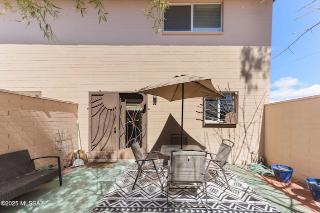 view of patio featuring outdoor dining area and a fenced backyard