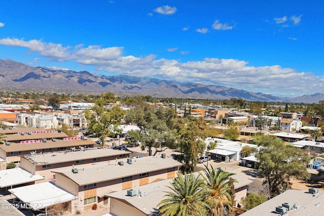 birds eye view of property with a mountain view