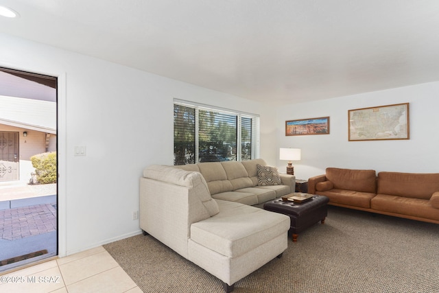 living area with light tile patterned flooring and baseboards