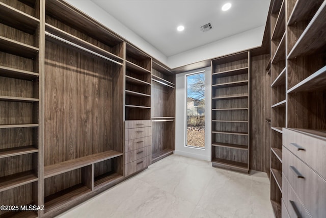 spacious closet featuring visible vents