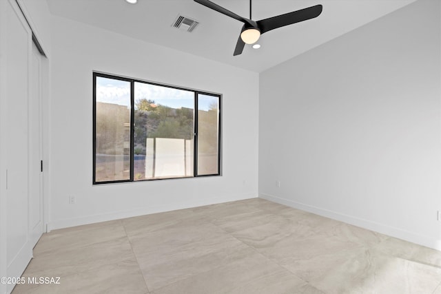 spare room featuring recessed lighting, visible vents, and baseboards