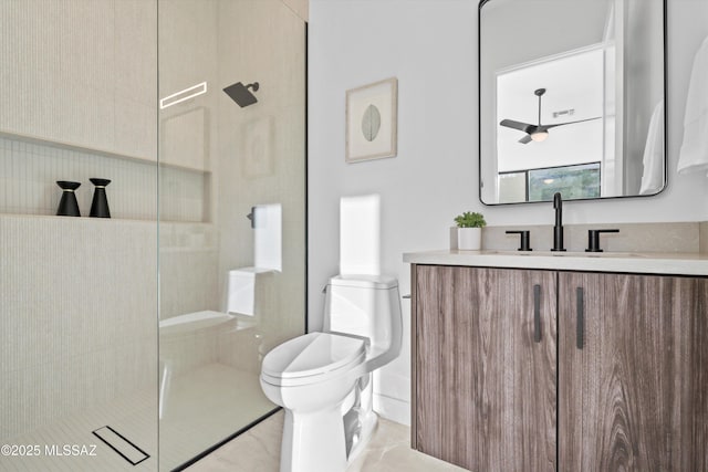 bathroom featuring vanity, toilet, and a tile shower