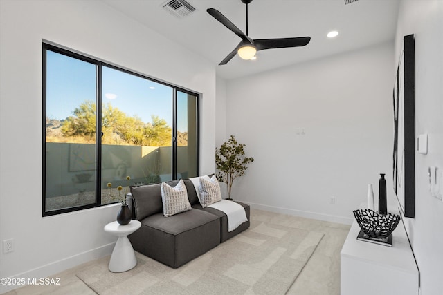 living area with recessed lighting, visible vents, baseboards, and a ceiling fan