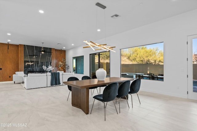 home office featuring recessed lighting, visible vents, and wood walls