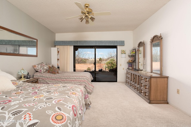 bedroom featuring a textured ceiling, ceiling fan, carpet flooring, and access to outside