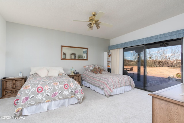 bedroom with access to outside, carpet flooring, a ceiling fan, and a textured ceiling