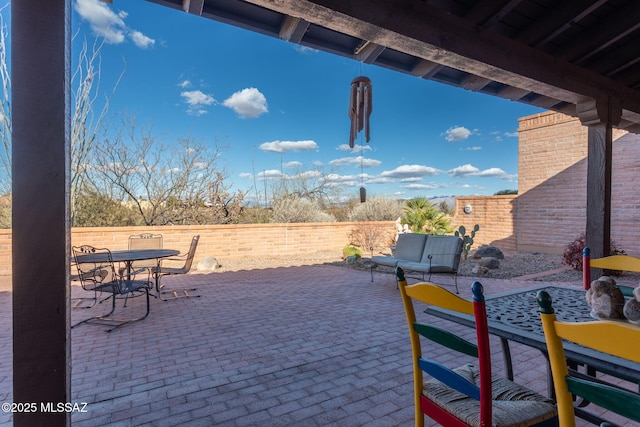 view of patio / terrace featuring outdoor dining area and a fenced backyard