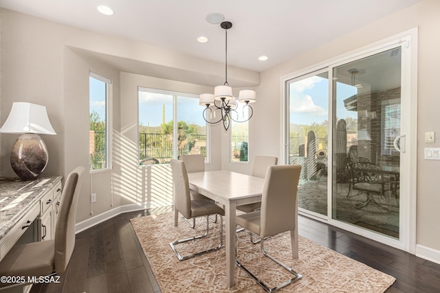 dining area with a notable chandelier, recessed lighting, baseboards, and dark wood-style flooring