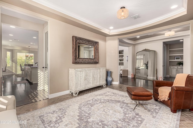 living area with baseboards, recessed lighting, arched walkways, crown molding, and a raised ceiling