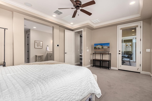 bedroom featuring a tray ceiling, crown molding, light colored carpet, and visible vents