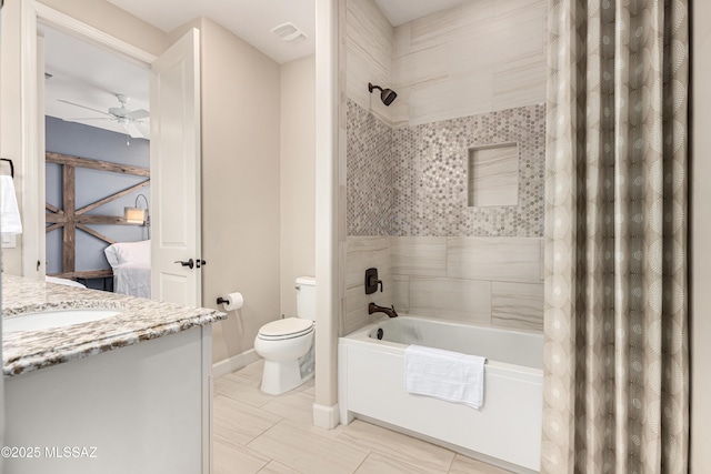 bathroom featuring vanity, visible vents, ceiling fan, toilet, and shower / tub combo with curtain