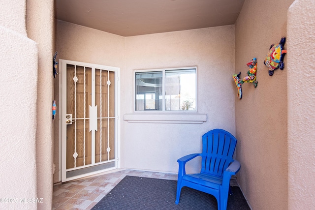 doorway to property with french doors and stucco siding