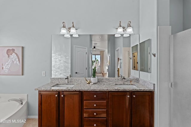 full bath with a sink, a ceiling fan, a bath, and double vanity