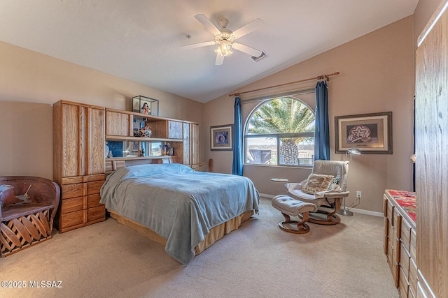 carpeted bedroom featuring vaulted ceiling, a ceiling fan, baseboards, and visible vents