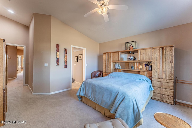 bedroom with lofted ceiling, a ceiling fan, baseboards, and light carpet