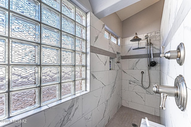 bathroom featuring tiled shower