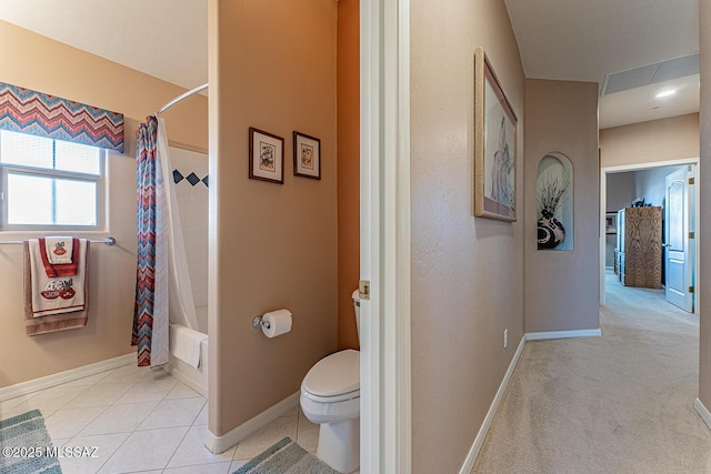 full bath with tile patterned flooring, toilet, shower / tub combo with curtain, and baseboards