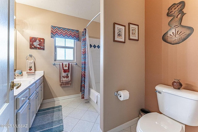 bathroom with tile patterned floors, toilet, vanity, and baseboards