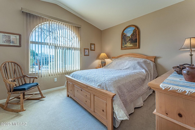 bedroom with baseboards, lofted ceiling, and light colored carpet