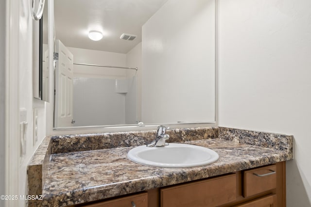 bathroom with vanity and visible vents