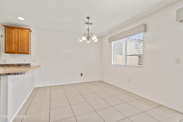 unfurnished dining area featuring visible vents, a chandelier, baseboards, recessed lighting, and light tile patterned floors