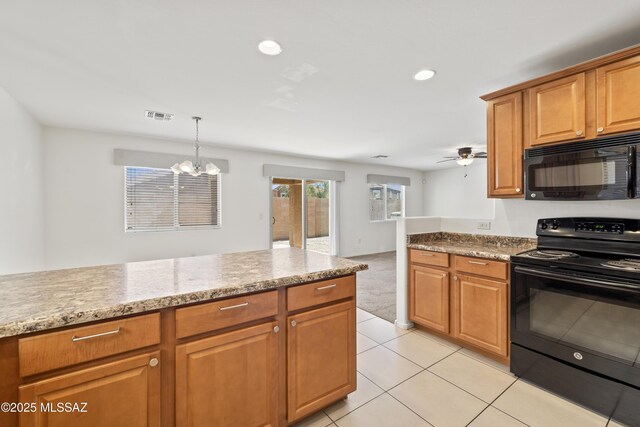 kitchen with visible vents, black appliances, brown cabinetry, and ceiling fan with notable chandelier