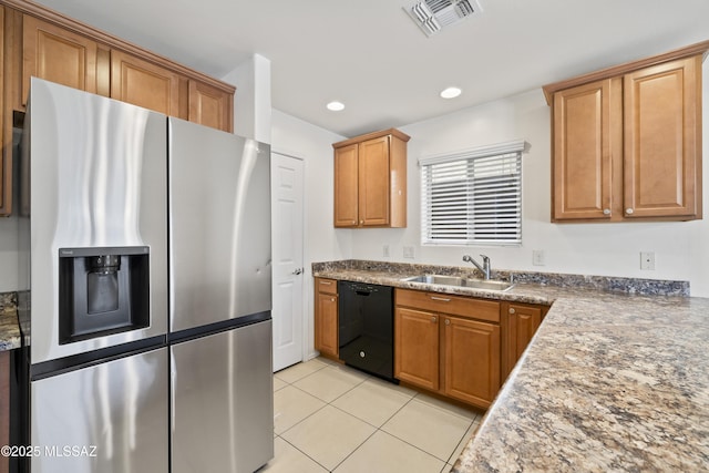 kitchen with a sink, light tile patterned floors, black dishwasher, visible vents, and stainless steel refrigerator with ice dispenser