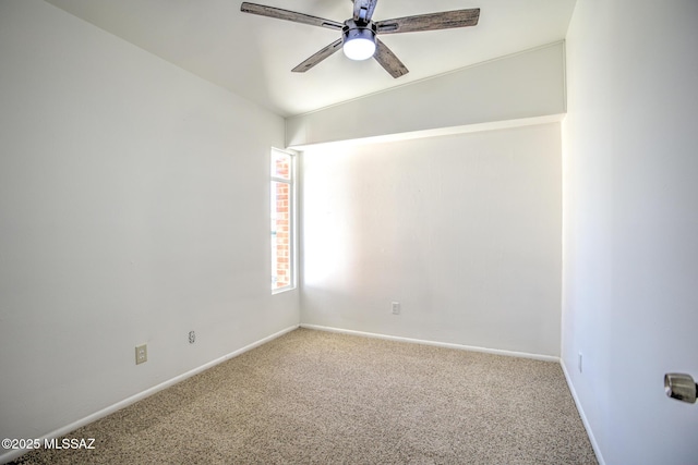 spare room featuring ceiling fan, carpet, and baseboards