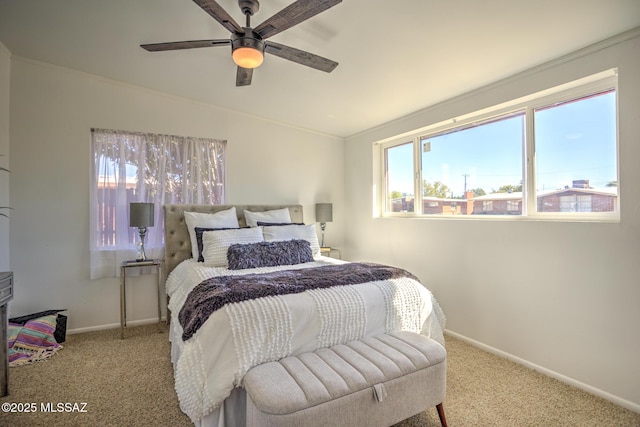carpeted bedroom featuring baseboards and ceiling fan