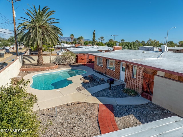 view of swimming pool featuring a fenced in pool and a fenced backyard