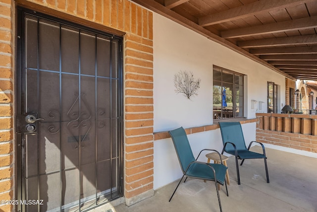 property entrance with brick siding