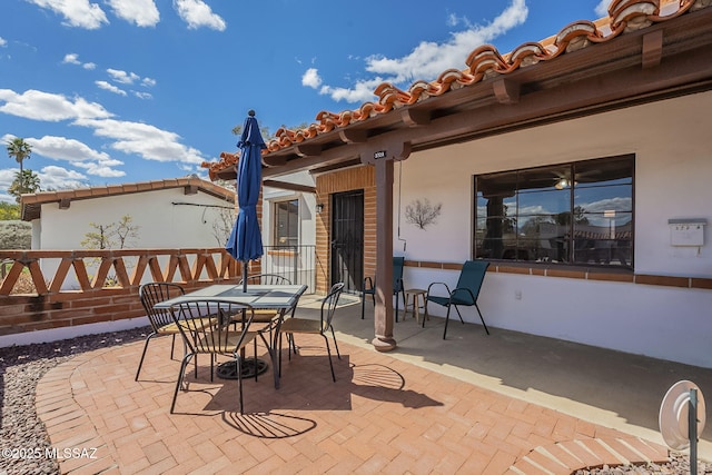 view of patio featuring outdoor dining area