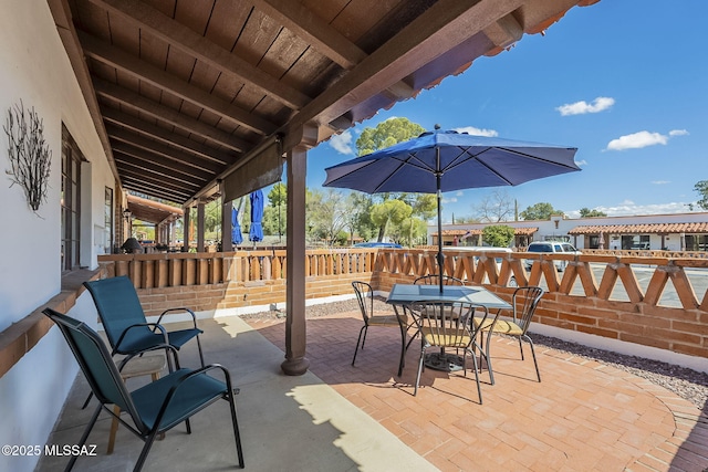 view of patio featuring outdoor dining area