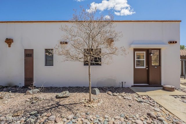 view of front of home featuring stucco siding