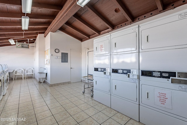 community laundry room featuring stacked washer and clothes dryer, electric panel, light tile patterned floors, wood ceiling, and washing machine and clothes dryer