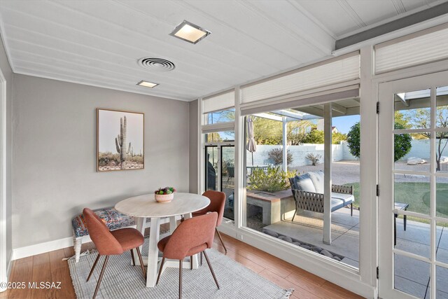 sunroom featuring visible vents