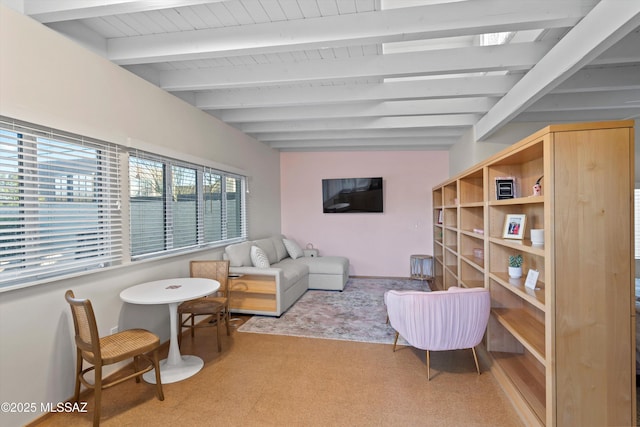 living area with lofted ceiling with beams