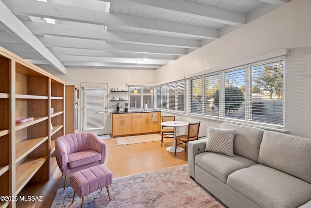 interior space featuring beam ceiling and light wood-style flooring