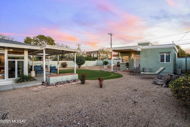 view of yard with central AC unit, a patio, and fence