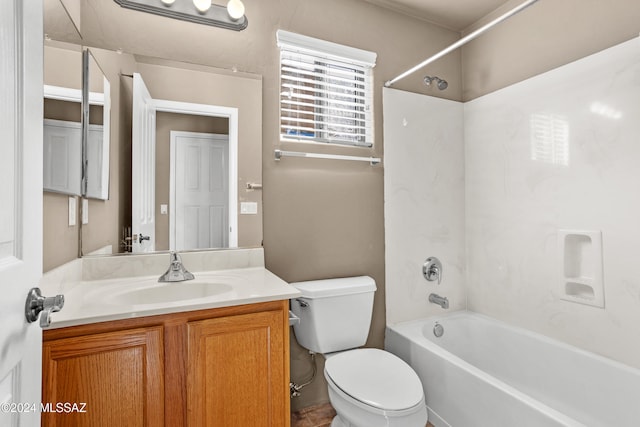 bathroom featuring toilet, vanity, and shower / tub combination