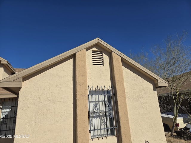 view of home's exterior with stucco siding