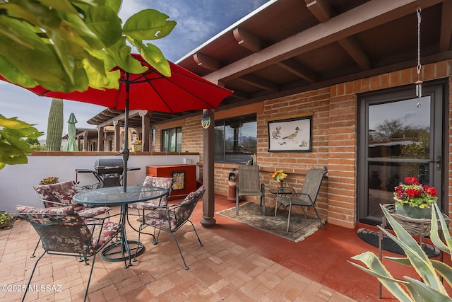 view of patio featuring outdoor dining area