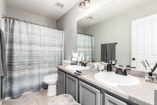 bathroom with a sink, visible vents, and toilet