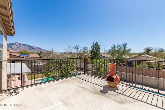 view of patio / terrace featuring a balcony and a mountain view