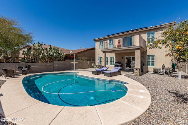 view of pool with a fenced backyard, a fenced in pool, and a patio