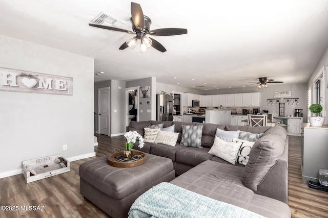 living room featuring visible vents, ceiling fan, baseboards, and wood finished floors