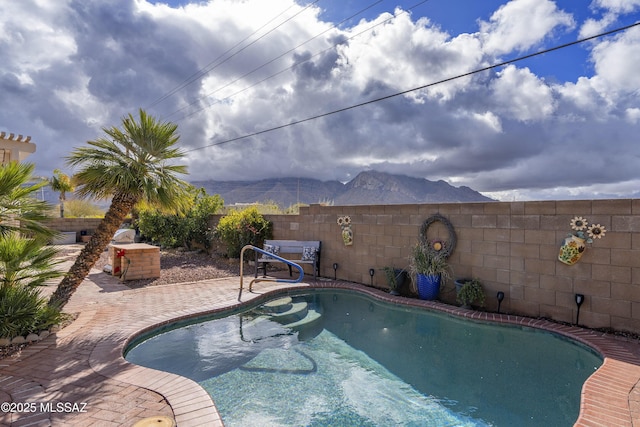 11219 N Platte Dr, Oro Valley, AZ 85737 - view of pool with a patio, a fenced backyard, and a mountain view