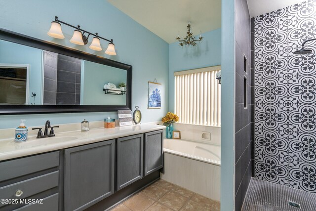 11219 N Platte Dr, Oro Valley, AZ 85737 - bathroom with vanity, a tile shower, tile patterned flooring, a garden tub, and a notable chandelier