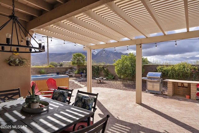 11219 N Platte Dr, Oro Valley, AZ 85737 - view of patio / terrace featuring grilling area, a mountain view, outdoor dining area, and a fenced backyard