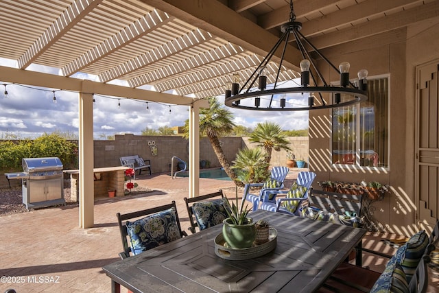 11219 N Platte Dr, Oro Valley, AZ 85737 - view of patio featuring grilling area, outdoor dining space, a pergola, and a fenced backyard
